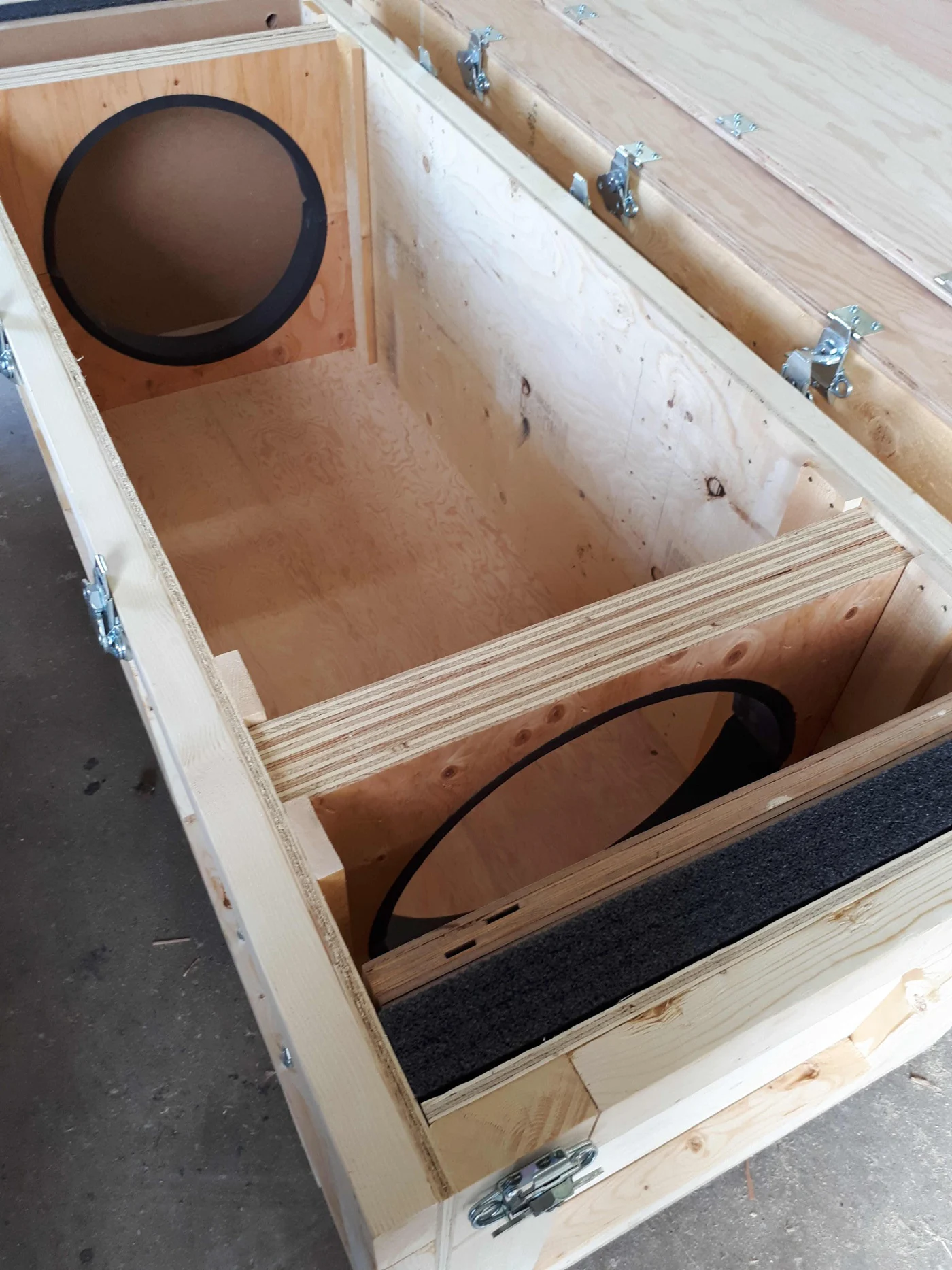 Custom wooden crate with circular cut-outs inside. Manufactured and available at 204 Pallet & Packaging in Winnipeg, Manitoba.