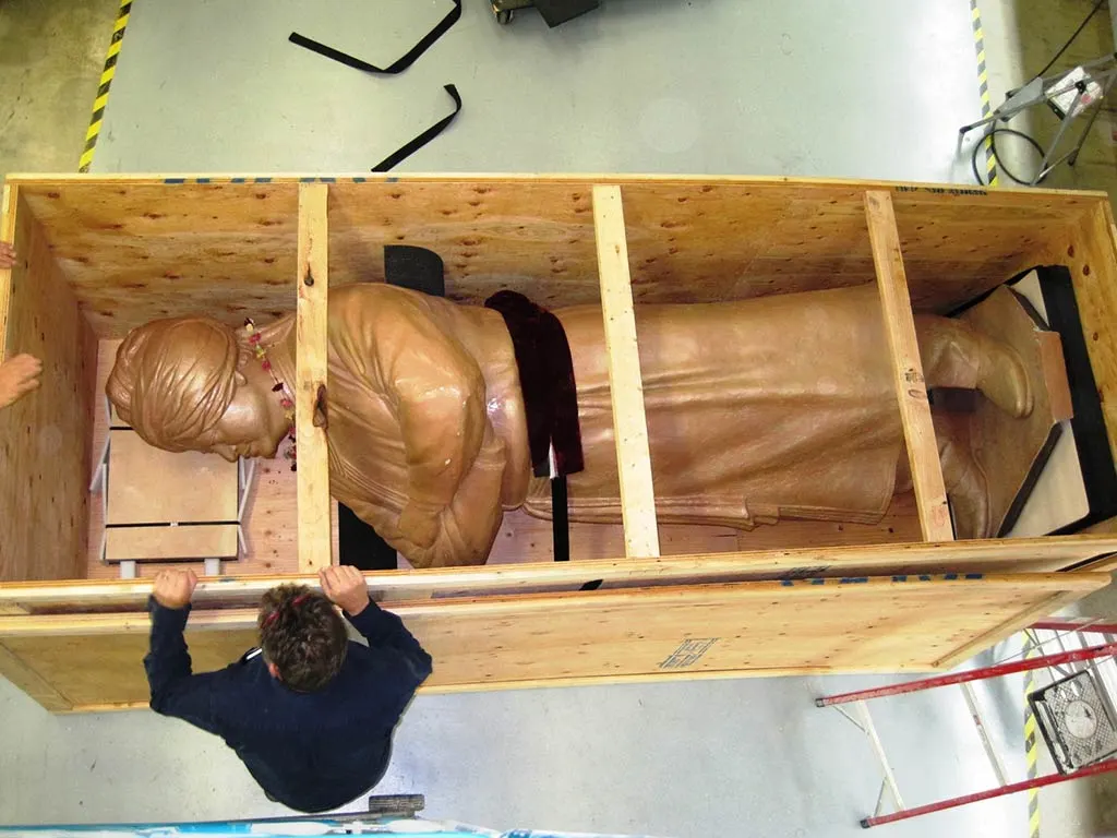 Large custom wooden shipping crate built by 204 Pallet & Packaging in Winnipeg, securely housing a statue for safe transport and protection.