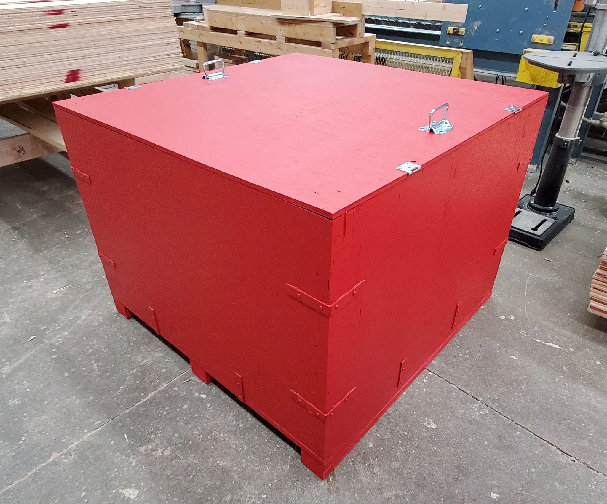 A red custom wood crate from 204 Pallet & Packaging in Winnipeg, Manitoba.