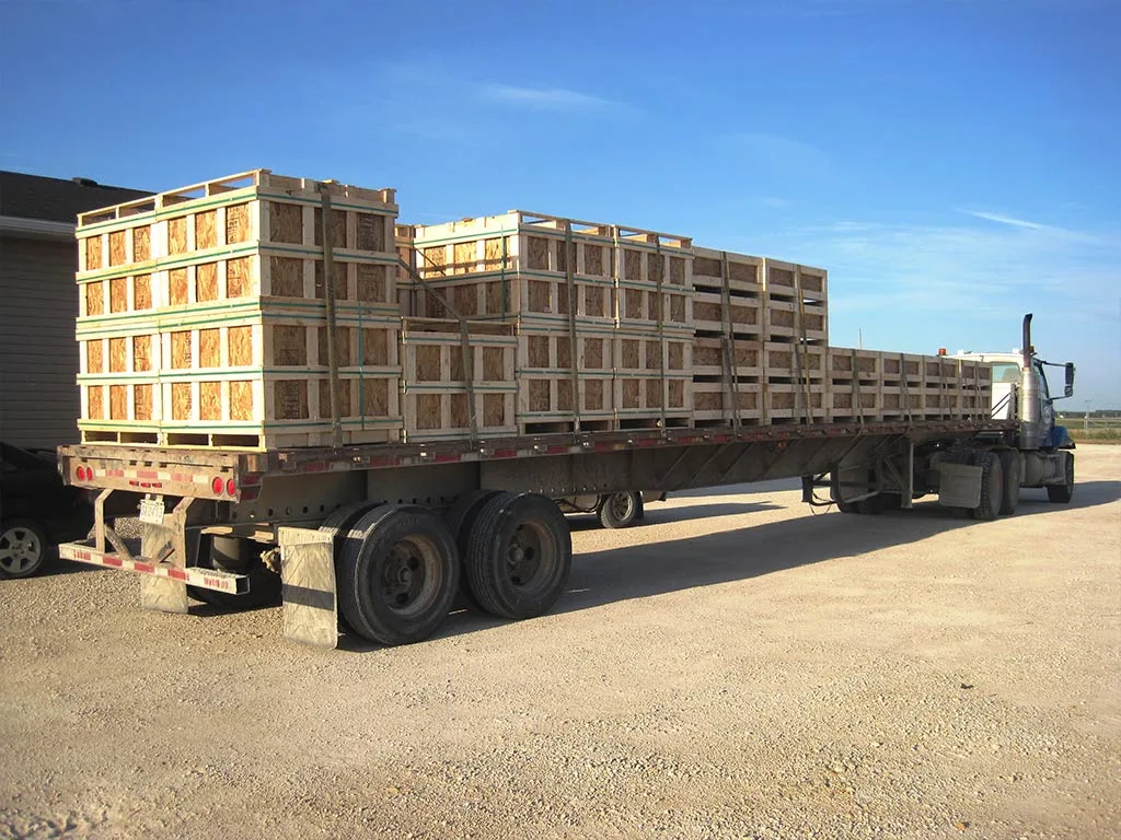 Truck carrying custom wooden crates from 204 Pallet & Packaging in Winnipeg Manitoba.